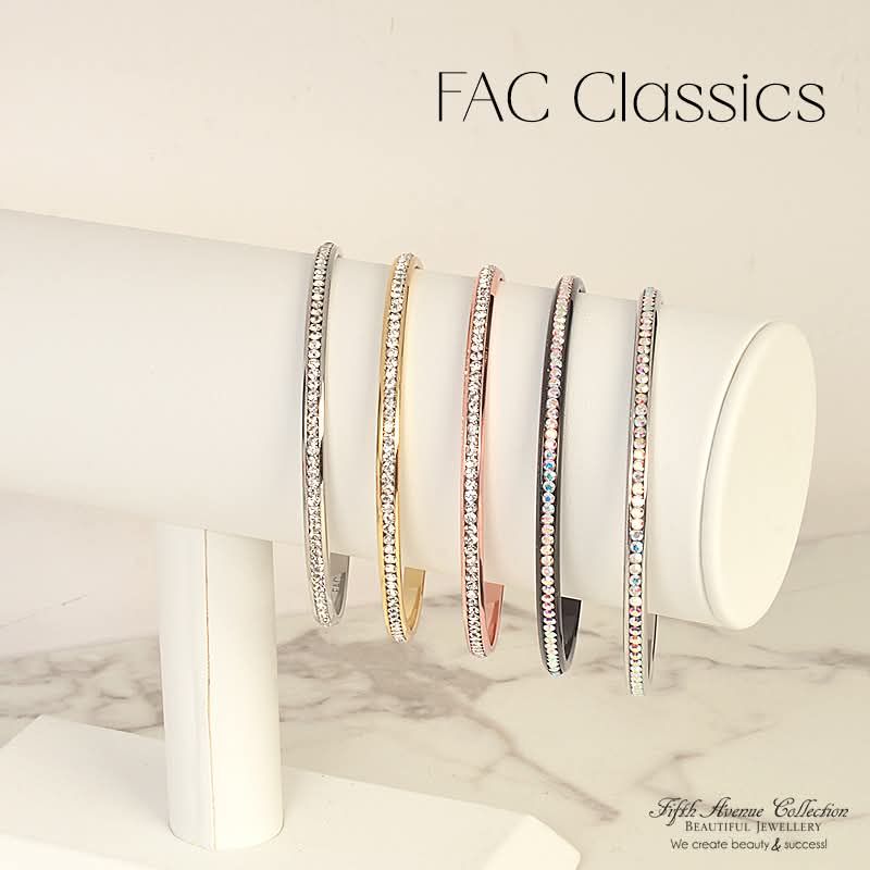 The Classic FAC Crystal Bangle.

A favorite and for good reason! This beauty is the beginning of an arm candy stack that will sparkle and shine. She is a stand alone subtle hint of elegance. She is the workhorse of your bracelets that you will reach for time and time again. My gold Crystal Bangle is 15 years old and still shines bright!
Right now through till August 31st, get your Crystal Bangle for just $69.95. 
Which one speaks to you?